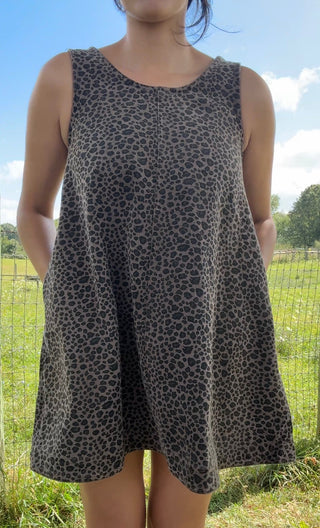 Sleeveless A-line dress in charcoal gray with subtle black leopard print and side pockets for a chic, relaxed fit.