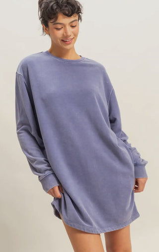 Model in oversized dusty blue sweatshirt dress with long sleeves and relaxed fit, casual cozy fall fashion look.