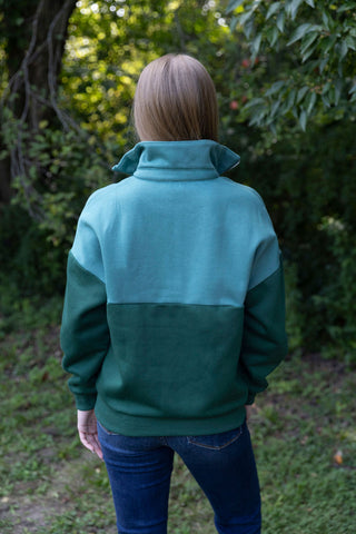 LOVE YOUR GREENS COLOR BLOCK SWEATER TWO TONE GREEN AND TEAL QUARTER ZIP PULLOVER HIGH COLLAR BACK VIEW