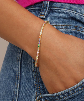 Tennis_bracelet__rainbow_colored_stimulated_diamonds_18k_plated_over_brass_close_up