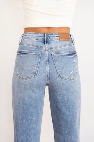 Judy Blue distressed high-waisted straight-leg jeans in vintage wash, featuring a ripped knee detail for an effortlessly edgy look