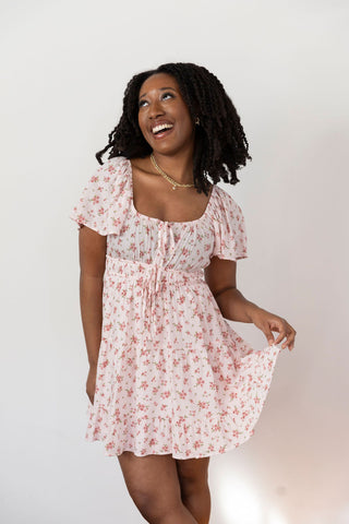 Flowy pink floral skirt with delicate ruffle hem, lightweight fabric, and a romantic vintage-inspired print for effortless charm.