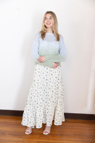 Soft ombre knit sweater in pastel blue and green with open crochet design, styled with a floral skirt for a dreamy spring outfit.